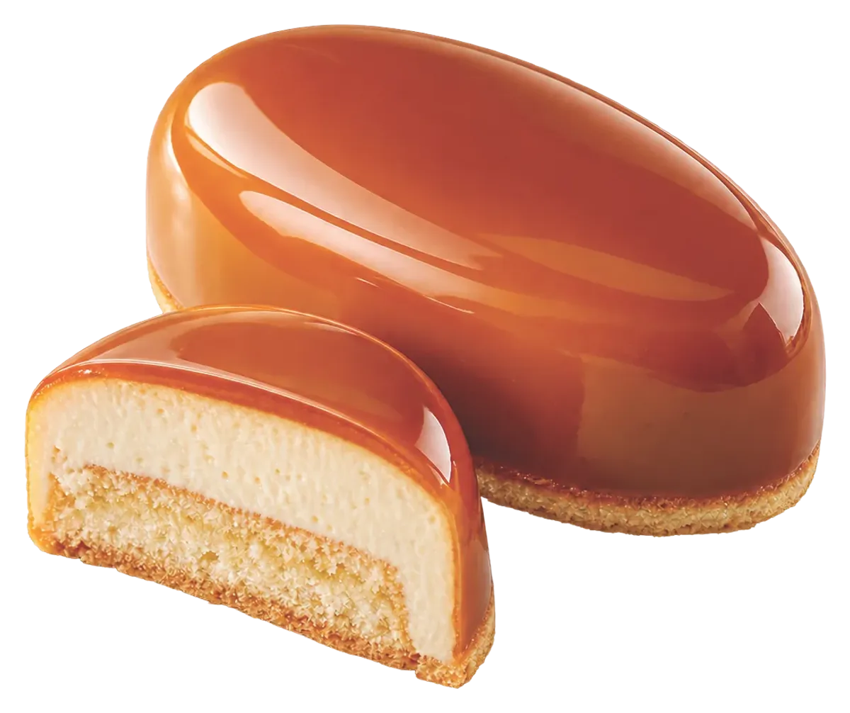 Oval mousse dessert coated in caramel cold glaze, shown with a cross-section