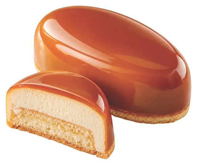 Oval mousse dessert coated in caramel cold glaze, shown with a cross-section