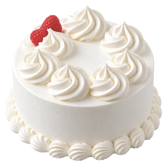 White cake decorated with whipped cream rosettes and raspberries