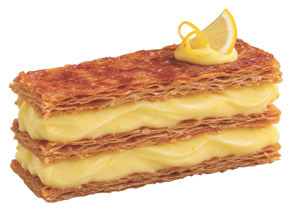 Mille-feuille layered with lemon cream, topped with a lemon slice and zest