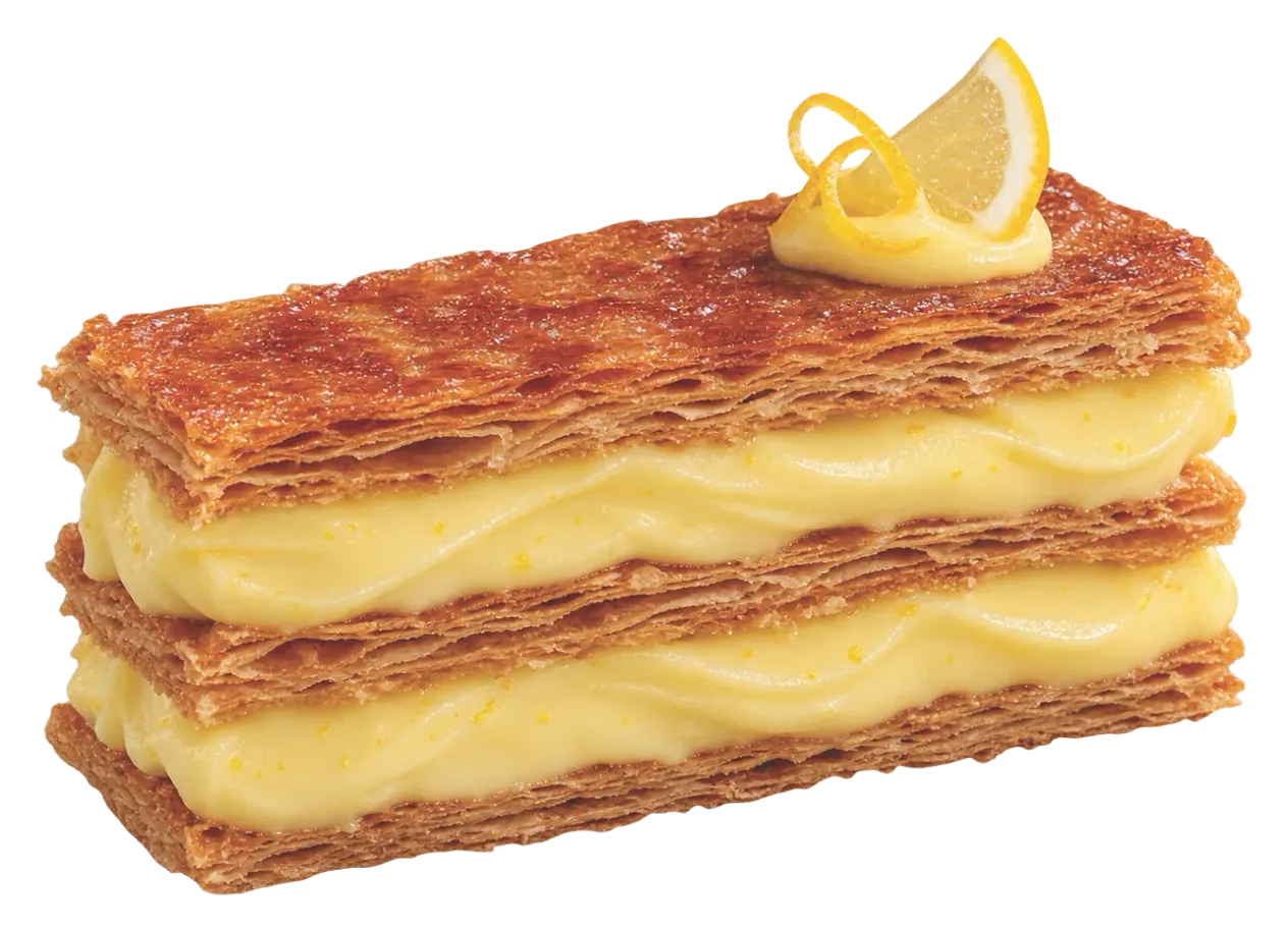 Mille-feuille layered with lemon cream, topped with a lemon slice and zest